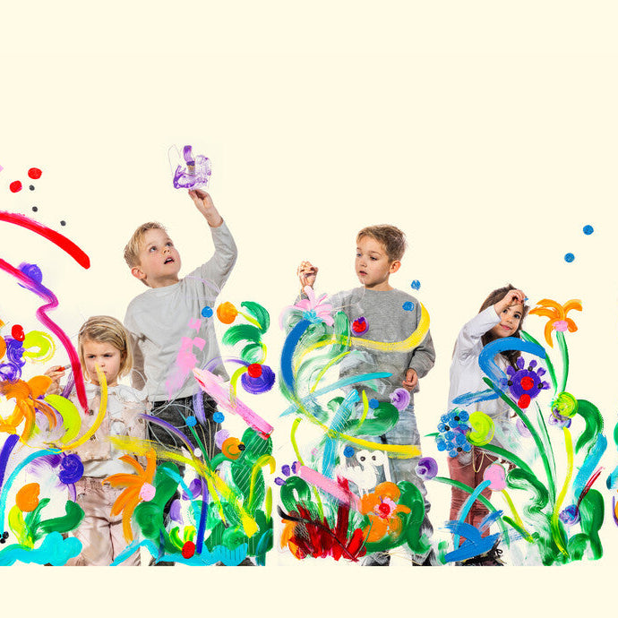 four children standing in front of a cream background, surrounded by colorful abstract floral and paint-splatter artwork. The children are wearing casual light-colored clothing and holding paintbrushes, with bright multicolored splashes and painted plant shapes around them.